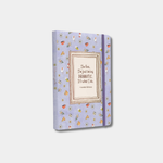 The light purple notebook features a pattern of small coffee mugs and flowers, with a framed quote in the center that reads, "I'm fine. I'm just being DRAMATIC. It's what I do. —Lorelai Gilmore."