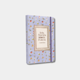 The light purple notebook features a pattern of small coffee mugs and flowers, with a framed quote in the center that reads, "I'm fine. I'm just being DRAMATIC. It's what I do. —Lorelai Gilmore."