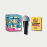 A novelty "Mini Mic Drop" gift set displayed against a grey background, containing a colorful cartoon-illustrated box, a small plastic toy microphone, and a yellow booklet titled "The Final Word on Mic Droppin'."