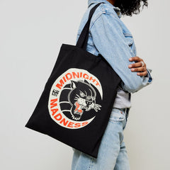 Woman carrying Midnight Madness TIFF tote over shoulder