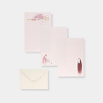 Three sheets of light pink lined stationary from a "Spirited Away" set feature illustrations of Kamajī, Chihiro, and No-Face, displayed alongside a plain cream-colored envelope.