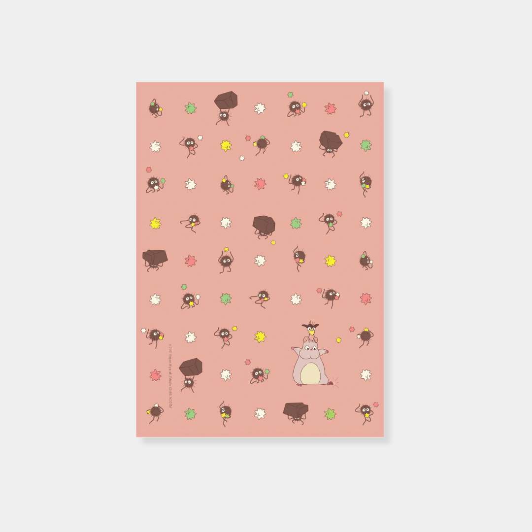 A sheet of pink stationery from a "Spirited Away" set features a repeating pattern of soot sprites carrying coal and colorful star-shaped candy, with an illustration of Boh in his mouse form and Yu-Bird at the bottom.
