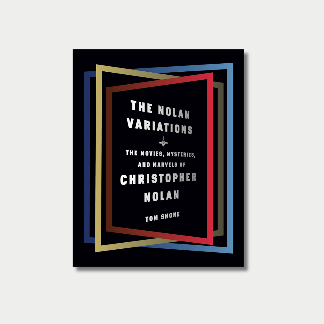 Book cover for the file "the nolan variations.png" titled "The Nolan Variations: The Movies, Mysteries, and Marvels of Christopher Nolan" by Tom Shone, featuring a central spinning top illustration framed by nested, overlapping rectangular borders in red, gold, and blue against a solid black background.